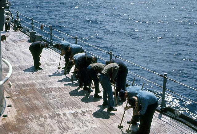 S19640401004.JPG - HOLYSTONING THE SHIP'STEAK WOOD DECKS