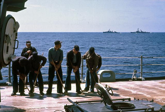 S19640401005.JPG - HOLYSTONING THE SHIP'STEAK WOOD DECKS