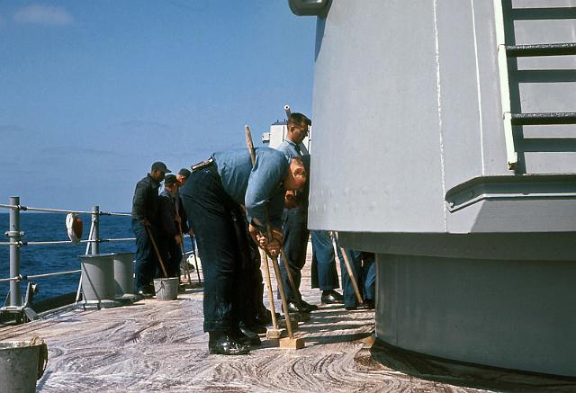 S19640401006.JPG - HOLYSTONING THE SHIP'STEAK WOOD DECKS