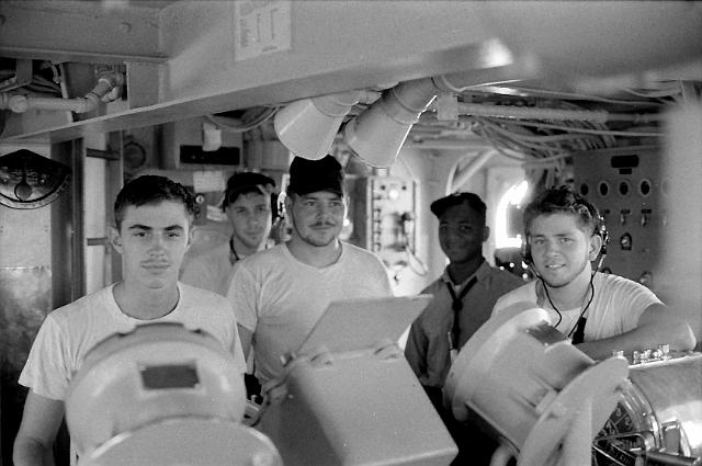 S196508000060C.JPG - HELMSMAN IS ALERT-STEADY AS SHE GOES